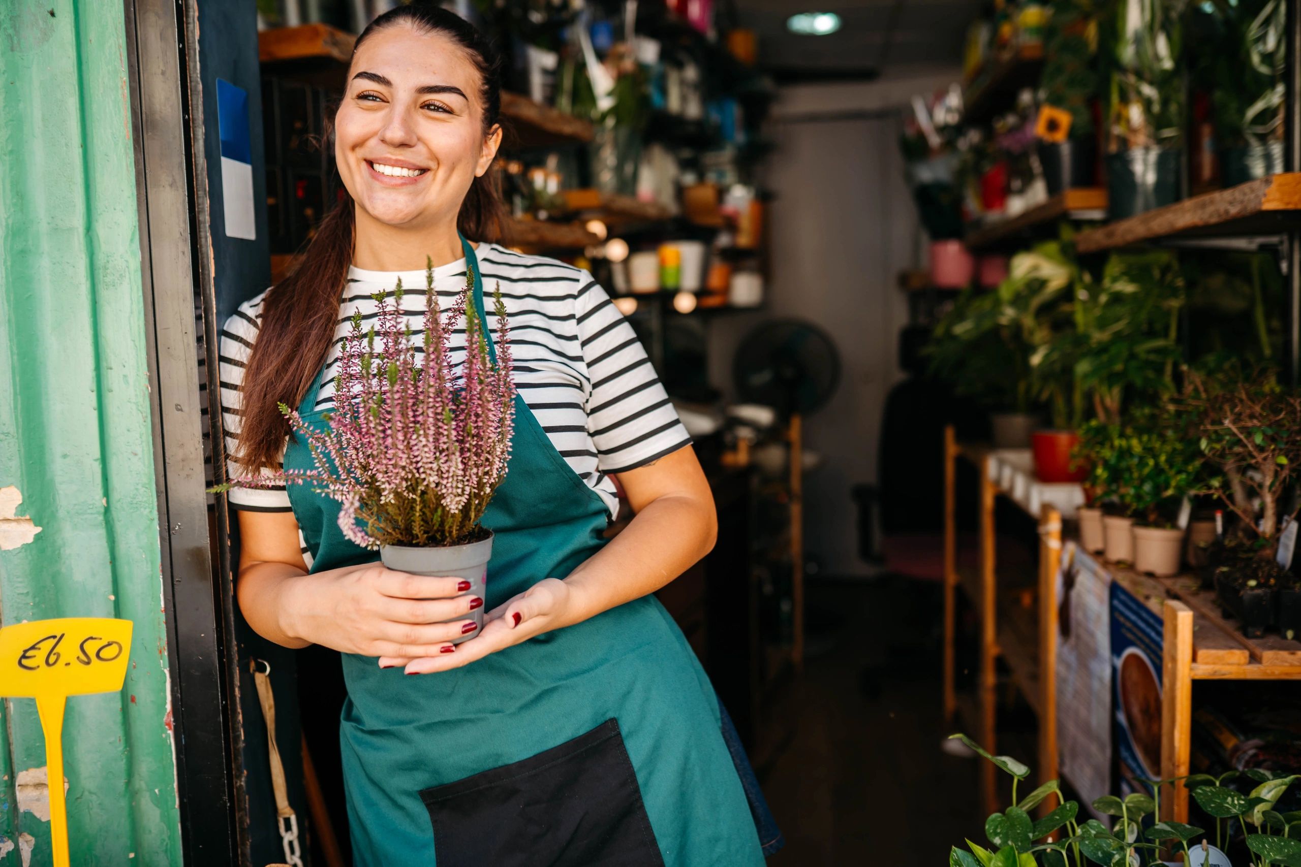 Florist standing in front of her flower shop
