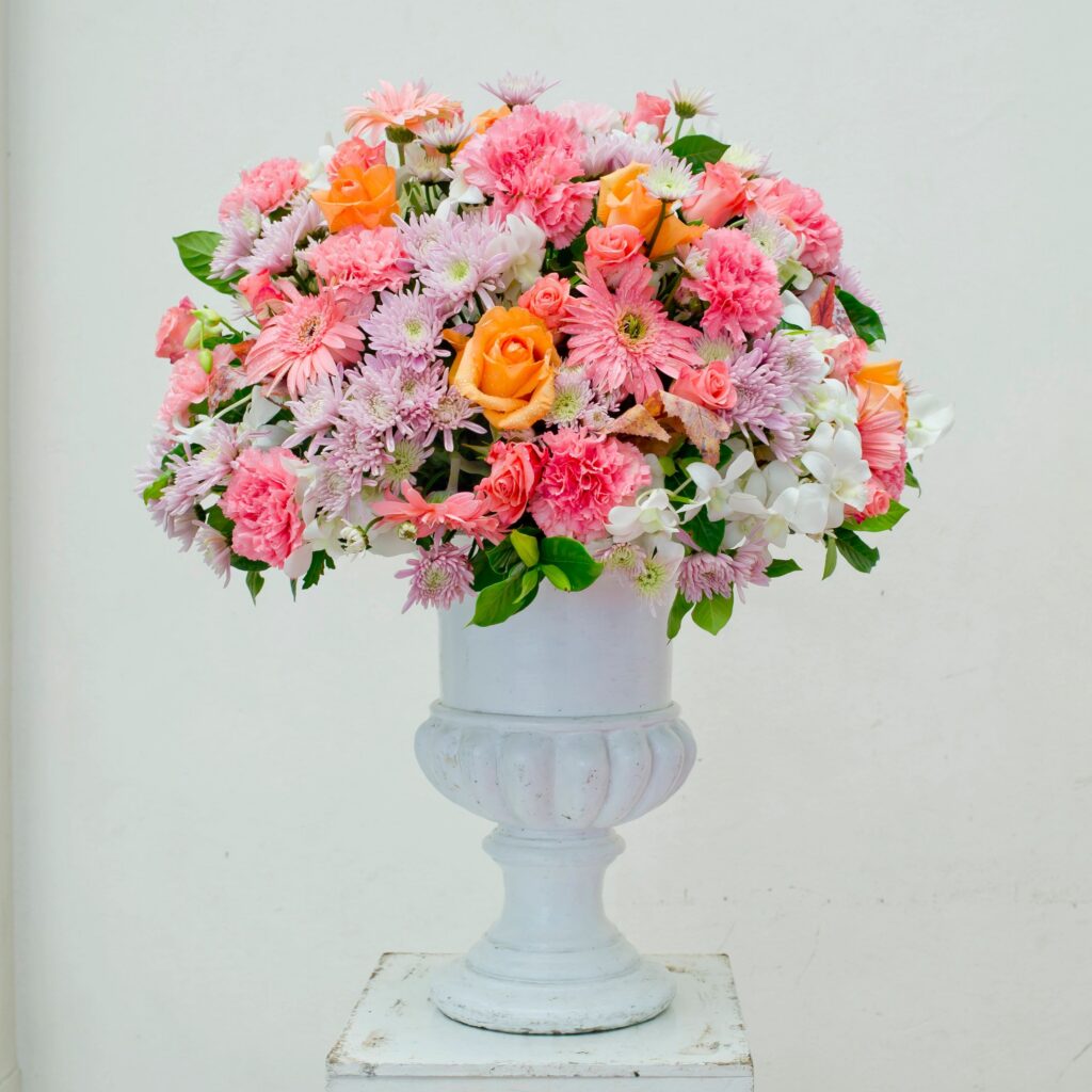 Glass vase with flowers beautiful ornament in a wedding