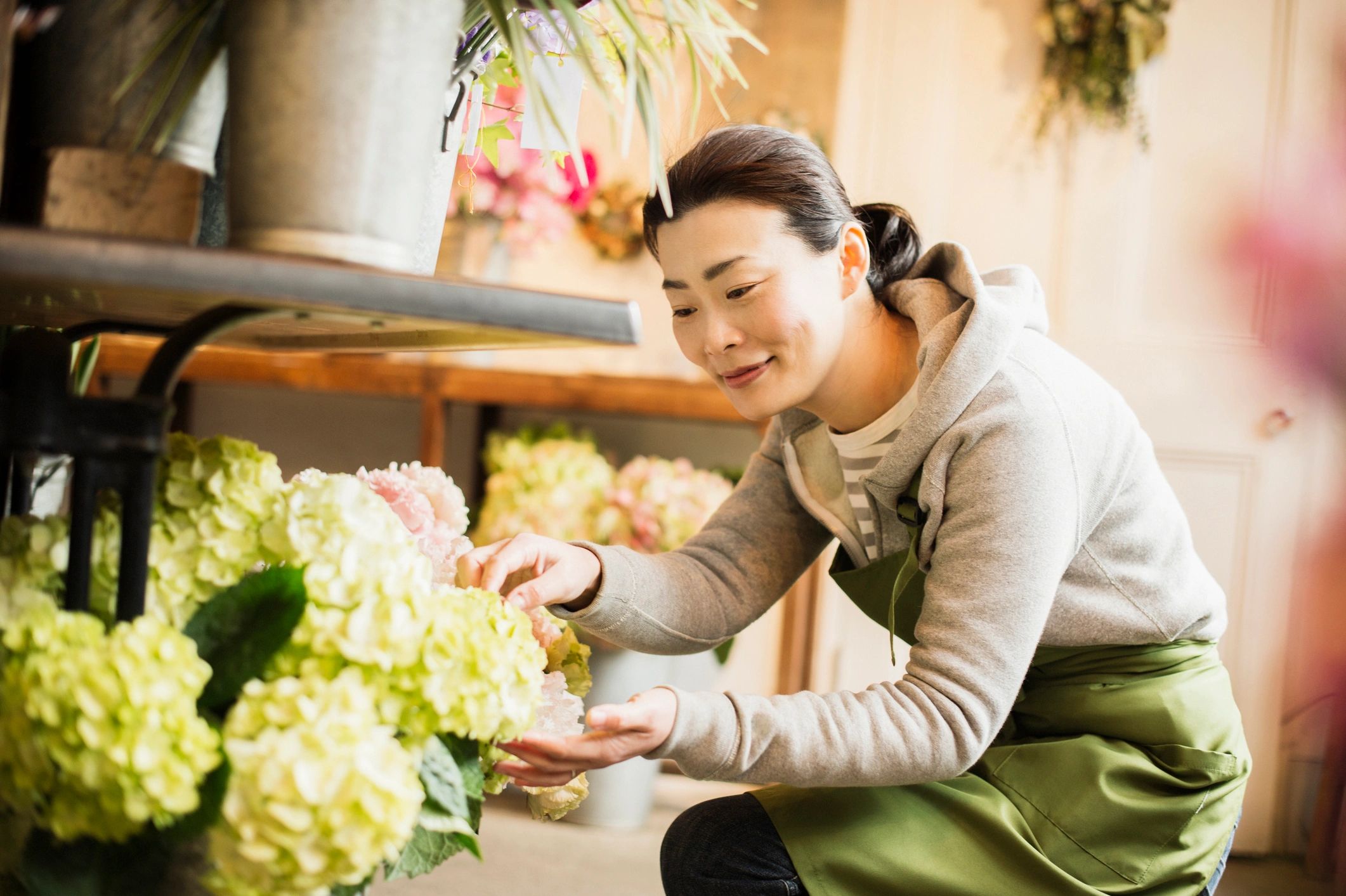 Florist arranging flowers in the shop