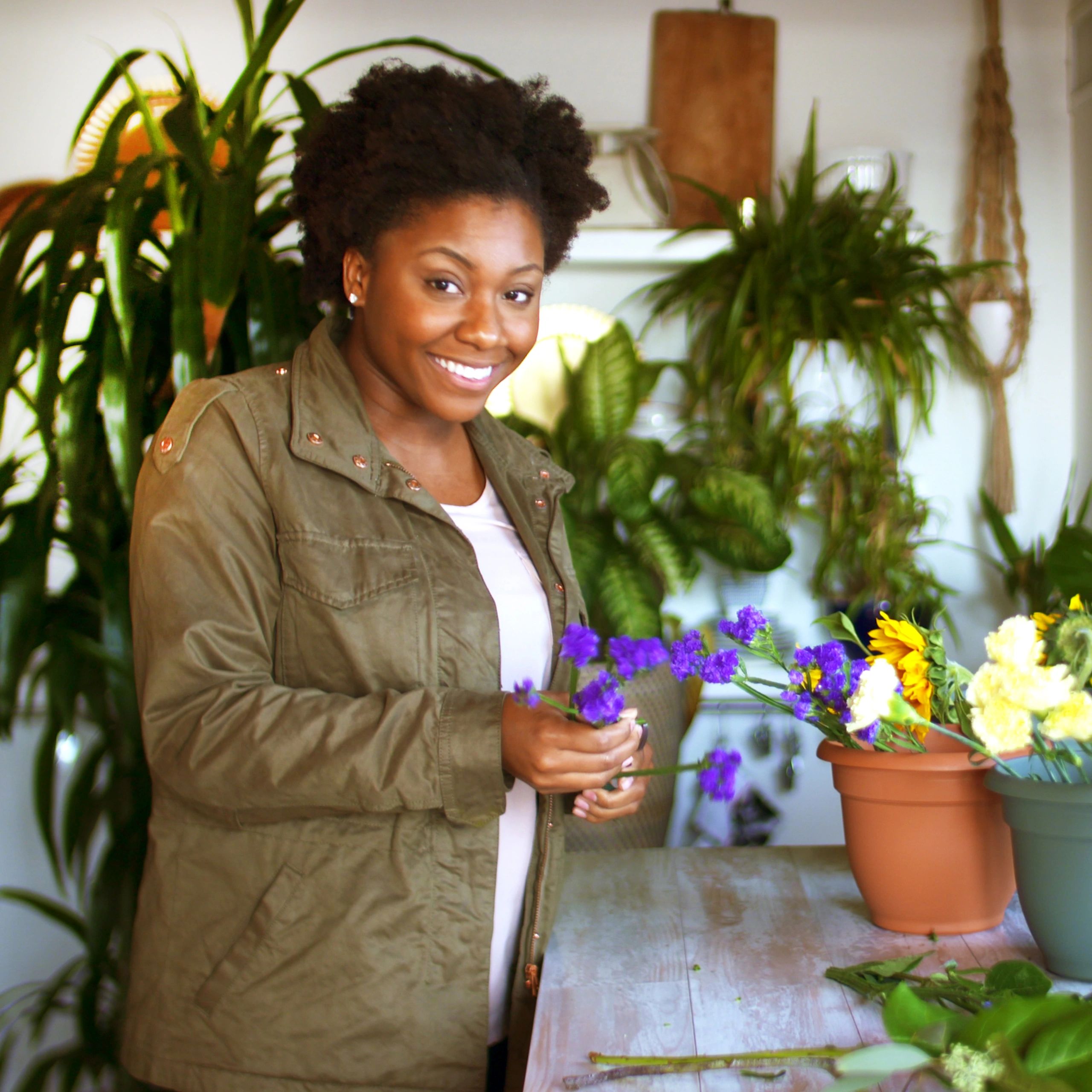 Florist arranging flowers in shop